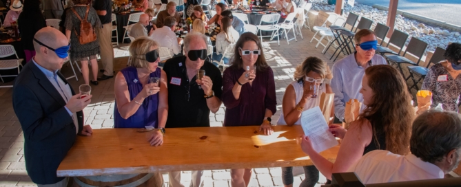 Wine tasting with blindfolds and distortion glasses at 2023 Anniversary Gala